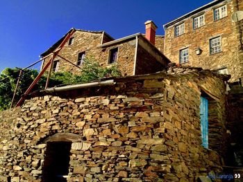 Low angle view of old building against sky