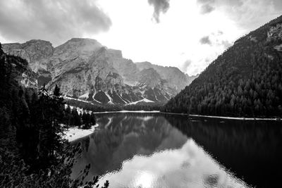 Scenic view of lake and mountains against sky