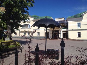 Buildings in city against blue sky