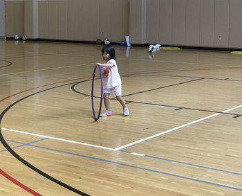 Boy playing with ball in background