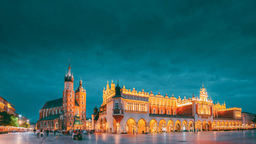 Illuminated buildings in city at night