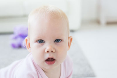 Portrait of cute baby at home