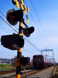 Electricity pylon against blue sky