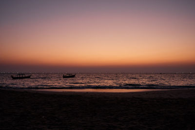 Scenic view of sea against clear sky during sunset