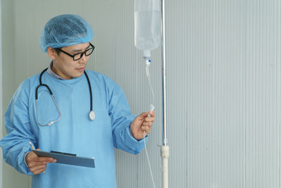 Mid adult man standing in a room