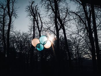 Low angle view of balloons against sky