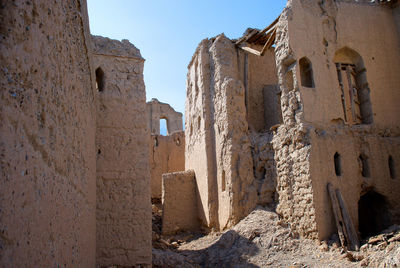 Low angle view of old building against clear sky