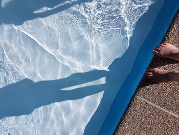 Low section of person at poolside