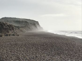 Scenic view of beach against clear sky