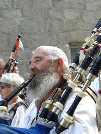 Close-up of man with arms raised
