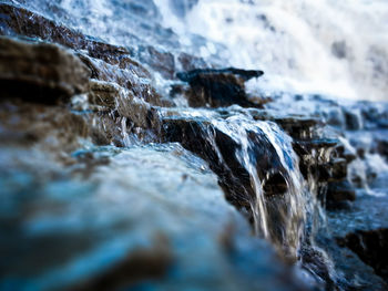 Close-up of water flowing over rocks