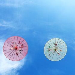 Low angle view of ferris wheel against sky