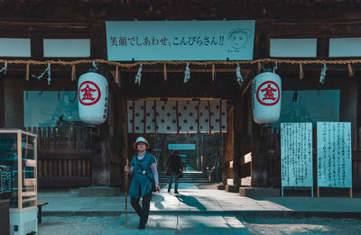 Woman with text on wall