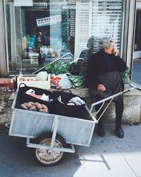 Two people sitting in the city