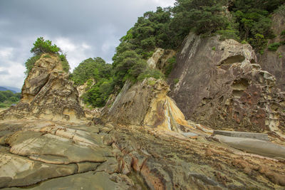 Rock formation on mountain against sky