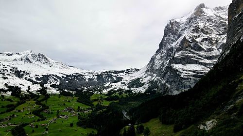 Scenic view of snowcapped mountains against sky