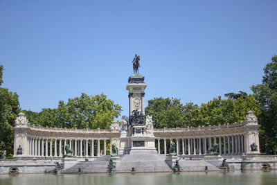 Retiro park big lake monument in madrid, spain
