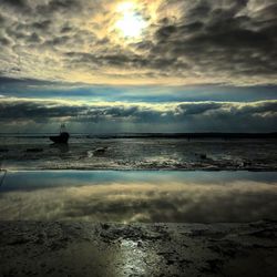 Scenic view of sea against sky at sunset