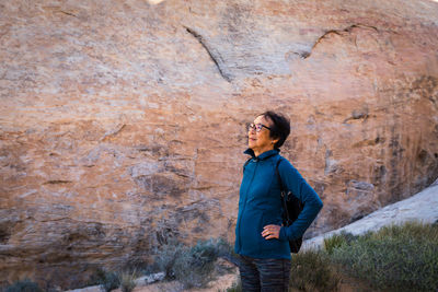 Full length of man standing on rock