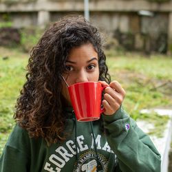 Portrait of woman drinking water