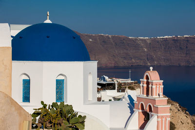 Traditional architecture of the churches of the oia city in santorini island