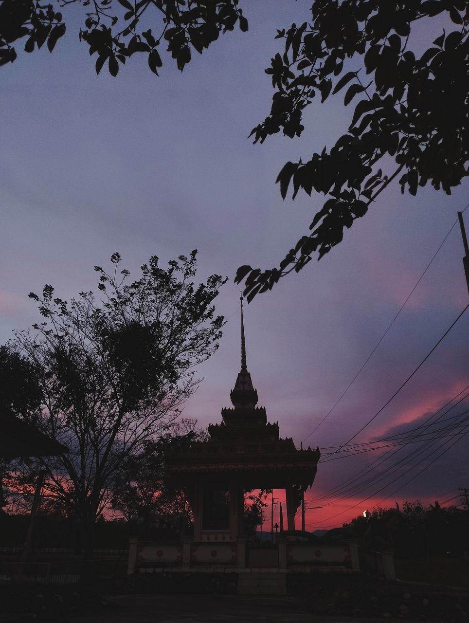 architecture, sky, built structure, tree, evening, dusk, temple - building, sunset, religion, plant, nature, building exterior, belief, travel destinations, silhouette, building, history, place of worship, cloud, the past, no people, darkness, spirituality, pagoda, travel, tradition, outdoors, city, tourism, ancient, beauty in nature, night