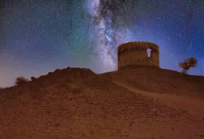 Low angle view of building against sky at night