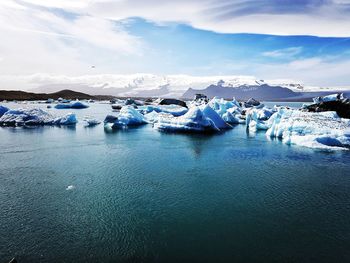 Scenic view of frozen sea against sky