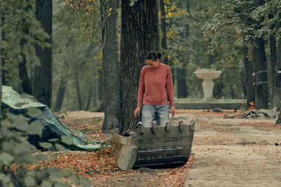 Rear view of man standing in forest