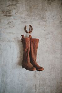 Directly above shot of shoes hanging on wall