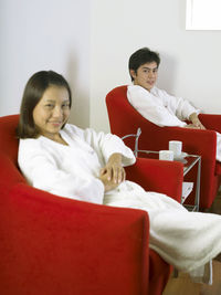 Young couple sitting on table