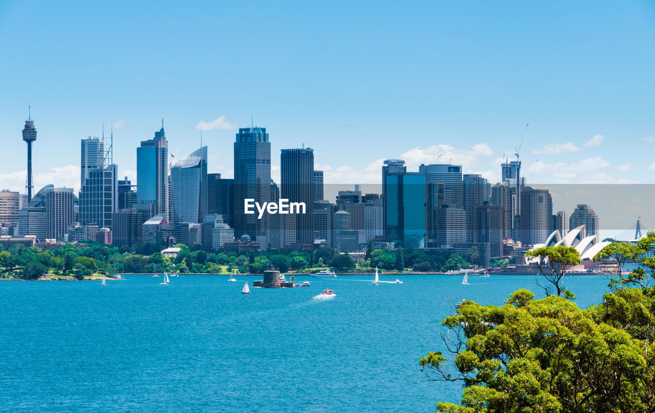 VIEW OF BUILDINGS IN CITY AT WATERFRONT