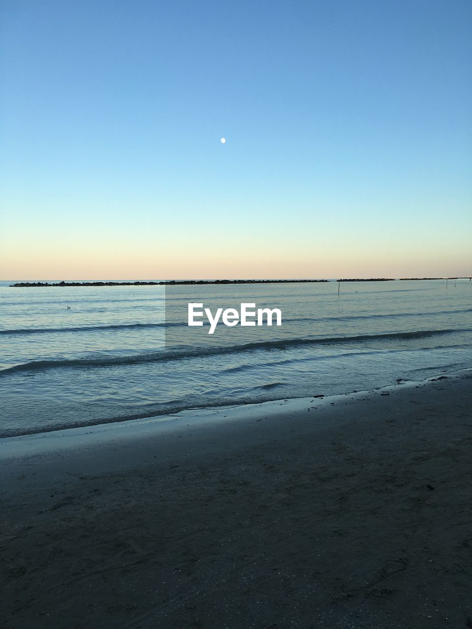 Scenic view of sea at sunset