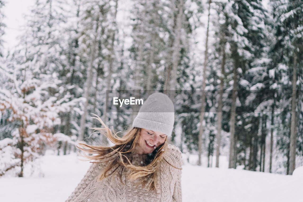 Portrait of a smiling woman in snow