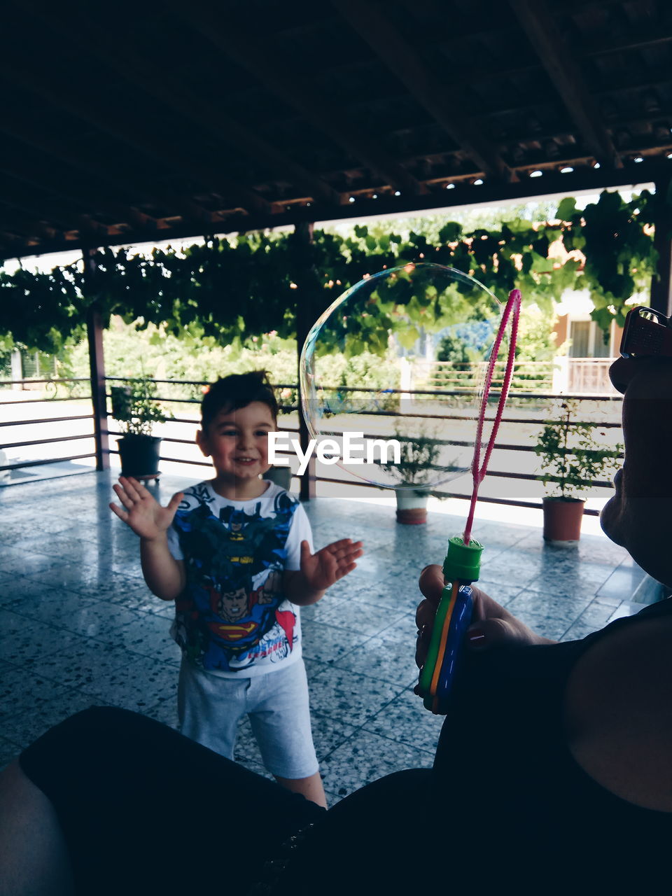 Boy seen through bubble