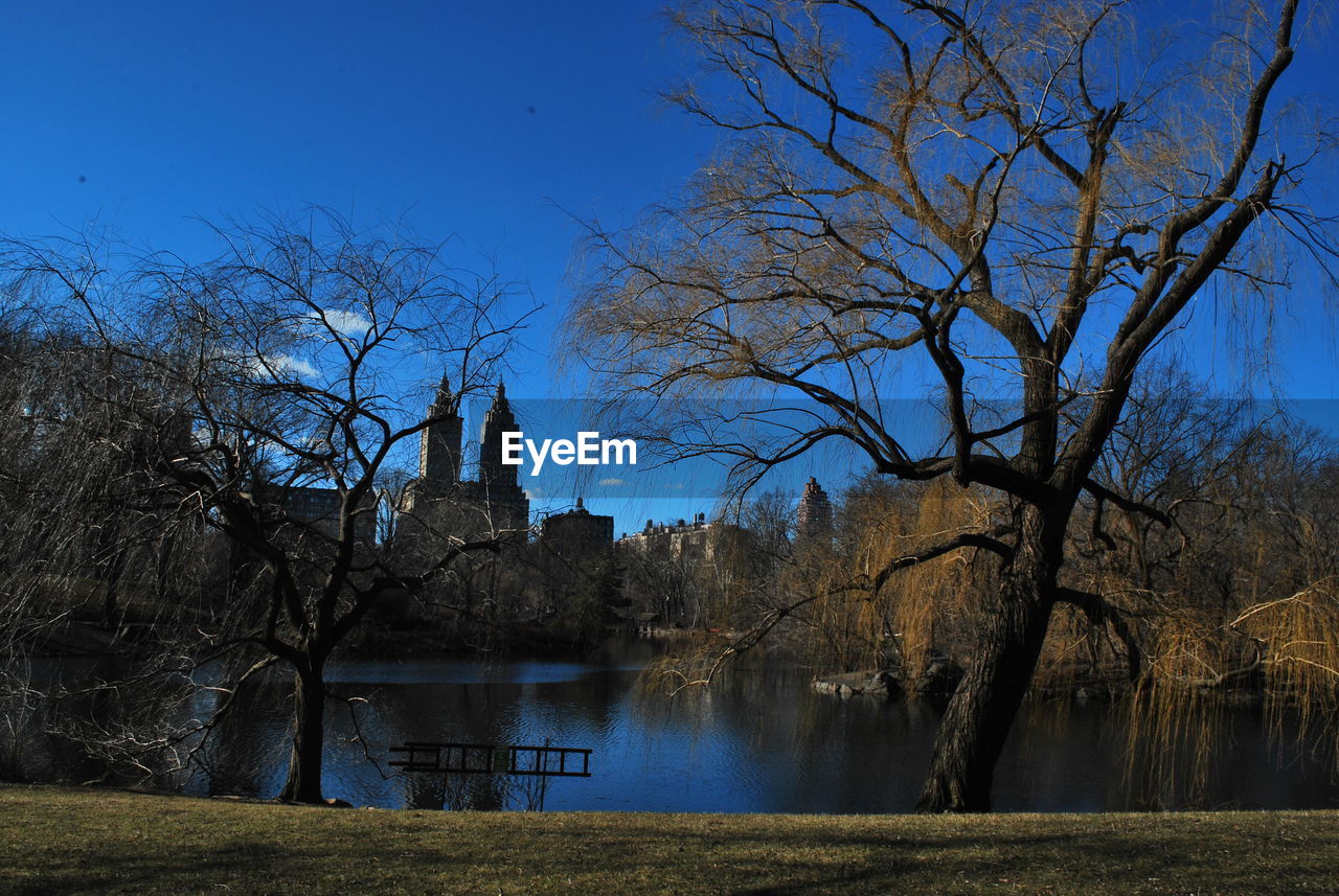 Lake in central park by the eldorado against sky