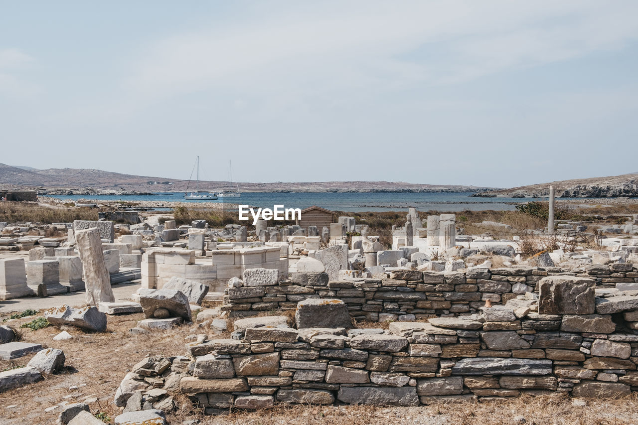 The remains of a buildings and agora of the competaliasts on the island of delis, greece.