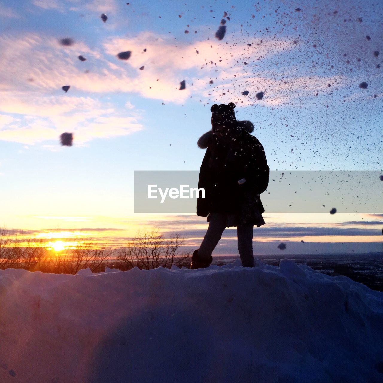 View of woman at sunset