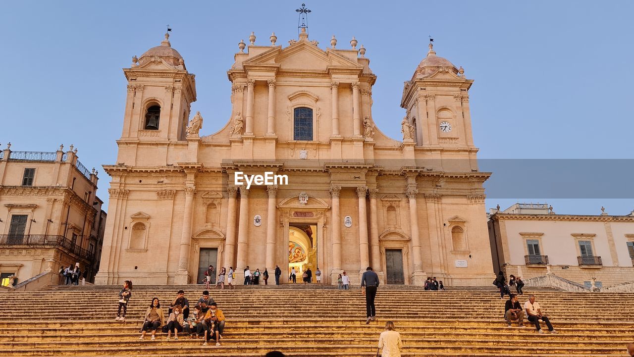 Group of people in front of historical building