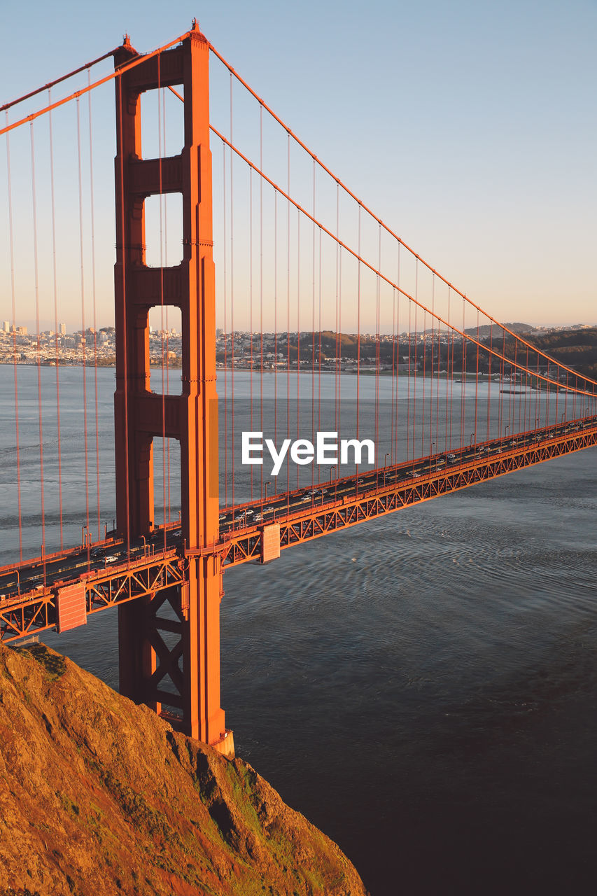 View of suspension bridge against clear sky