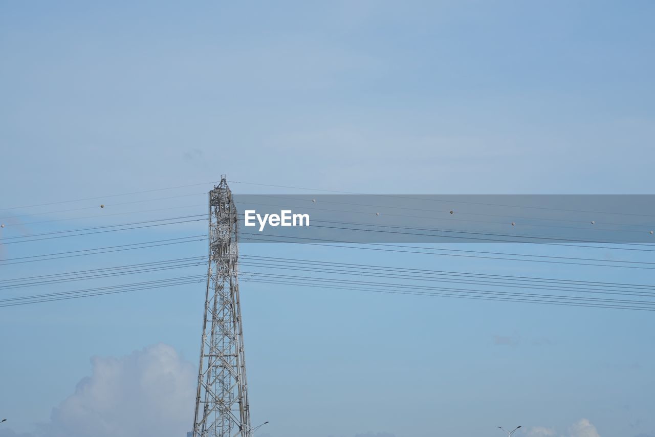 LOW ANGLE VIEW OF ELECTRICITY PYLONS AGAINST SKY