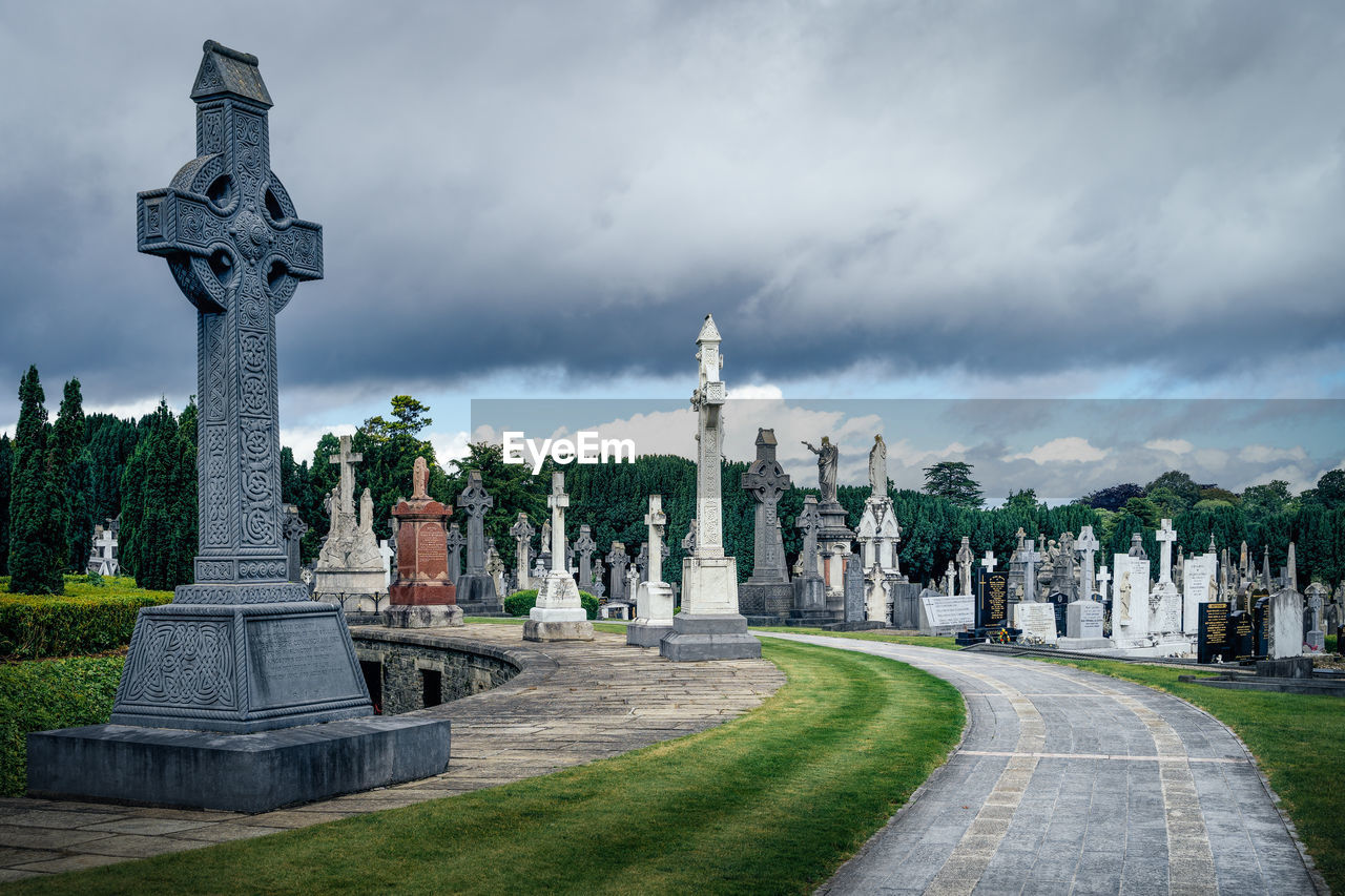 Graves with celtic crosses and sculptures in glasnevin cemetery, ireland
