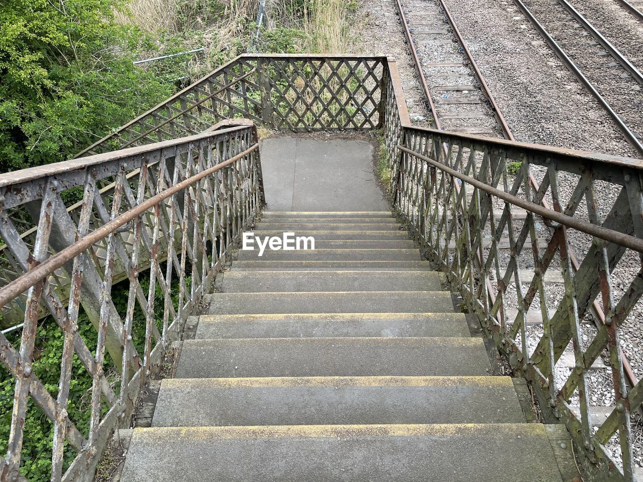 the way forward, railing, walkway, architecture, bridge, built structure, footbridge, plant, no people, staircase, nature, day, steps and staircases, tree, outdoors, footpath, diminishing perspective, transportation, forest, land, track, wood, metal, tranquility, stairs