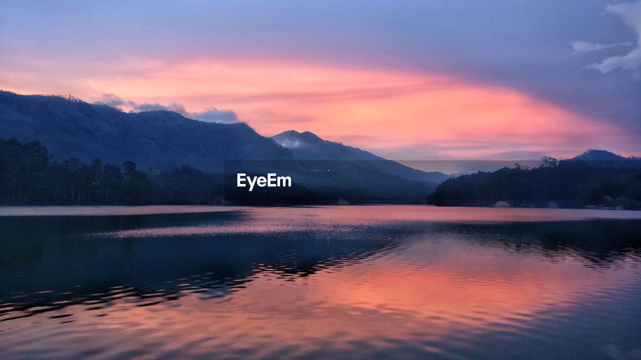 Scenic view of lake against sky during sunset