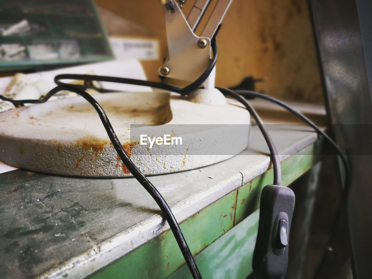 Close-up of equipment with cable on table