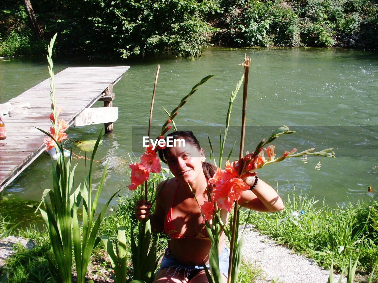 FULL LENGTH OF YOUNG WOMAN IN WATER