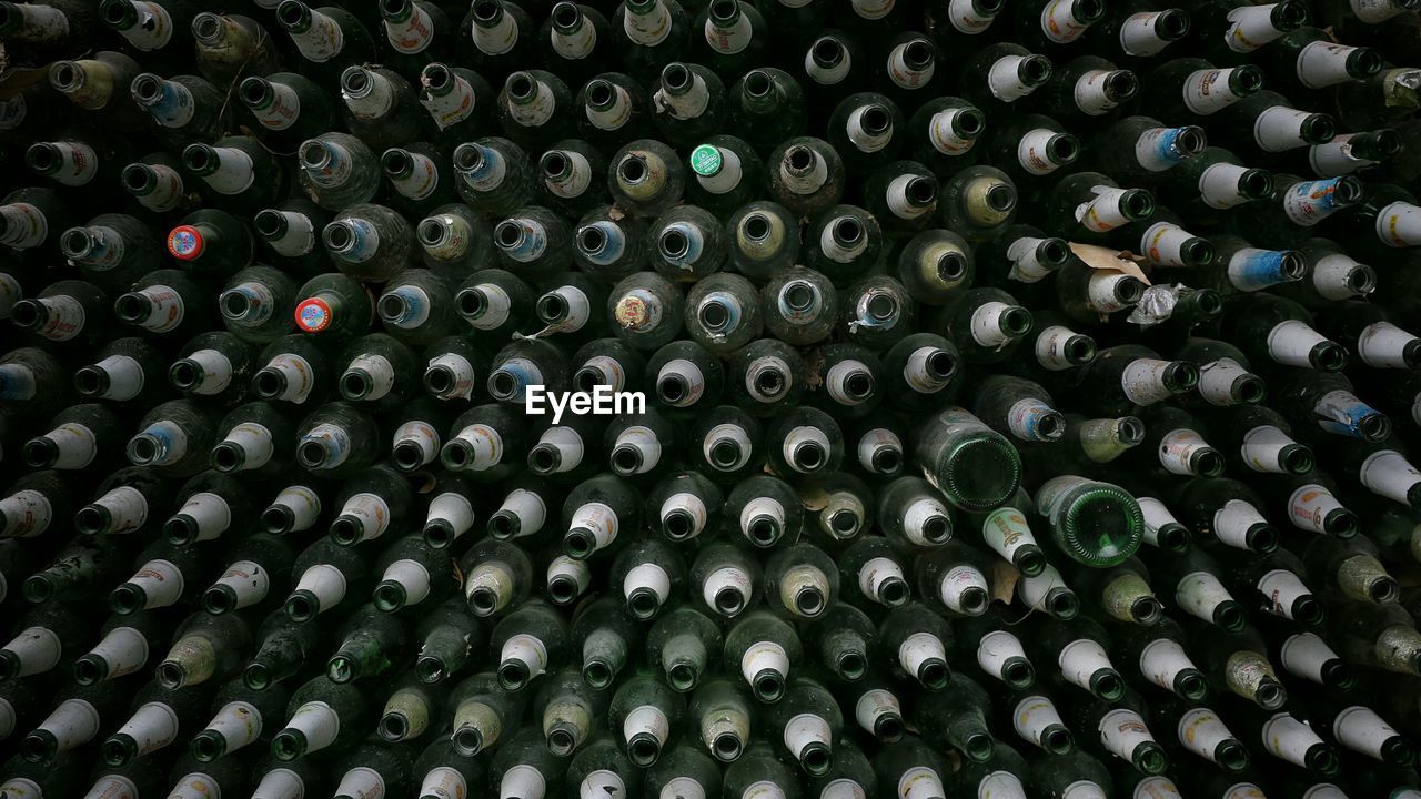 Full frame shot of wine bottles at winery