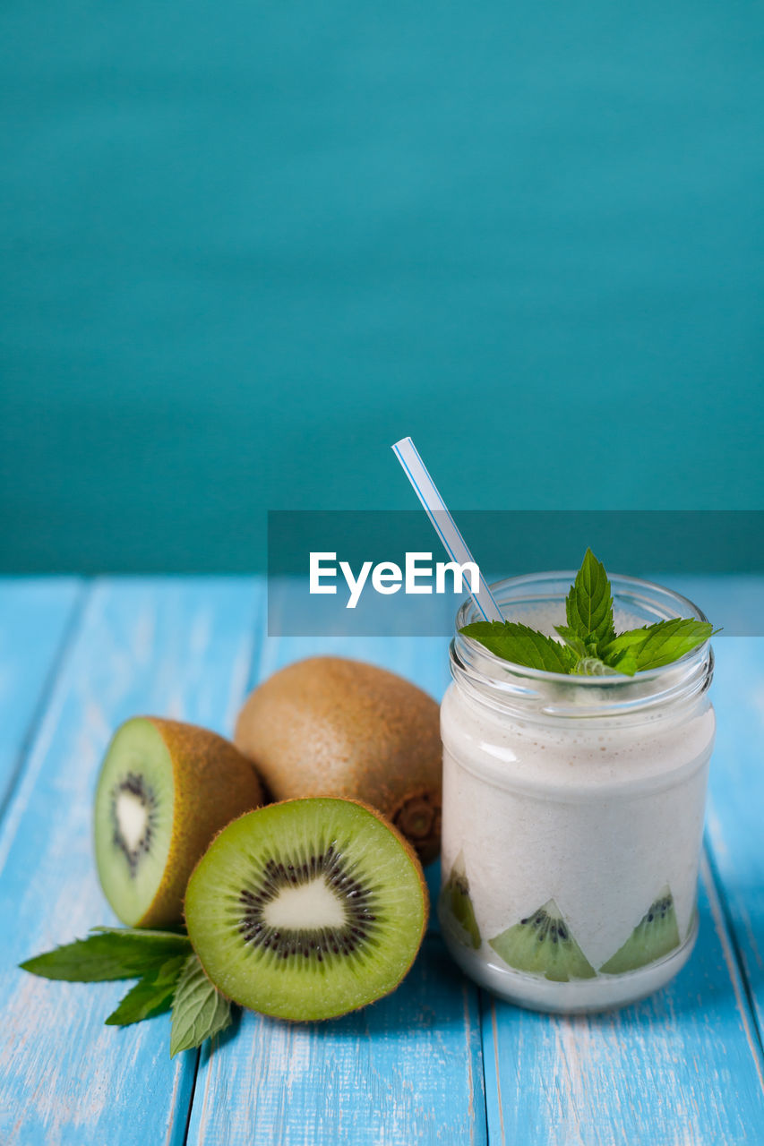 Close-up of kiwi drink on table