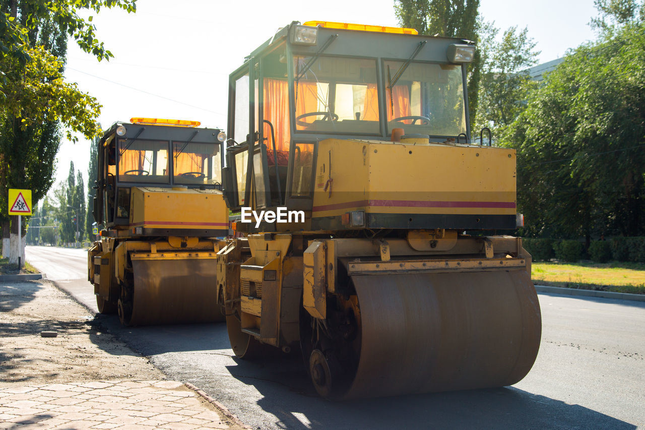 Road paving machinery in the city, pressure on the asphalt.