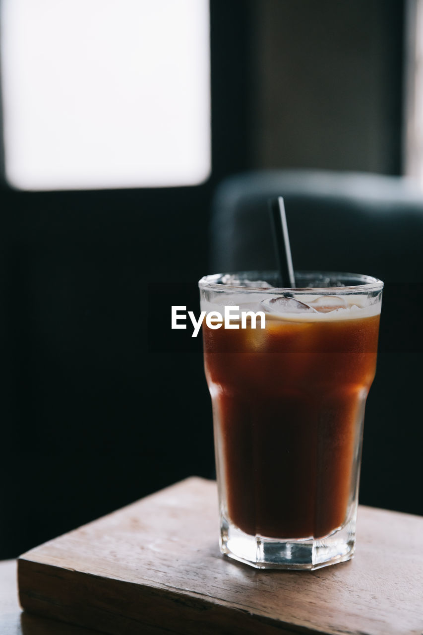 CLOSE-UP OF COFFEE IN GLASS